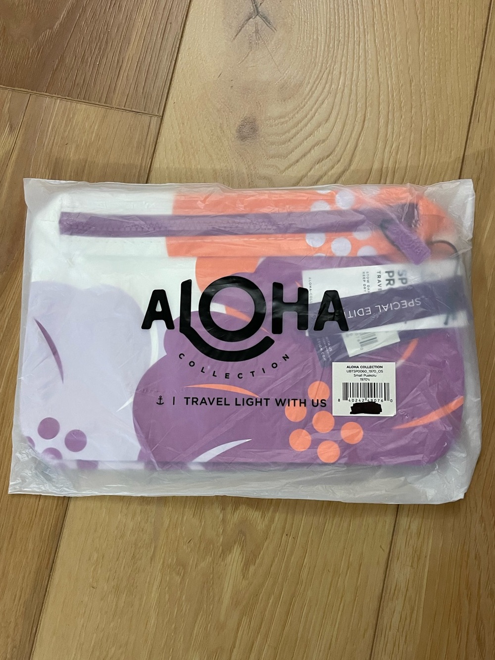 ALOHA Collection x Hawaiian Airlines Small Purple and Orange Floral Travel Pouch